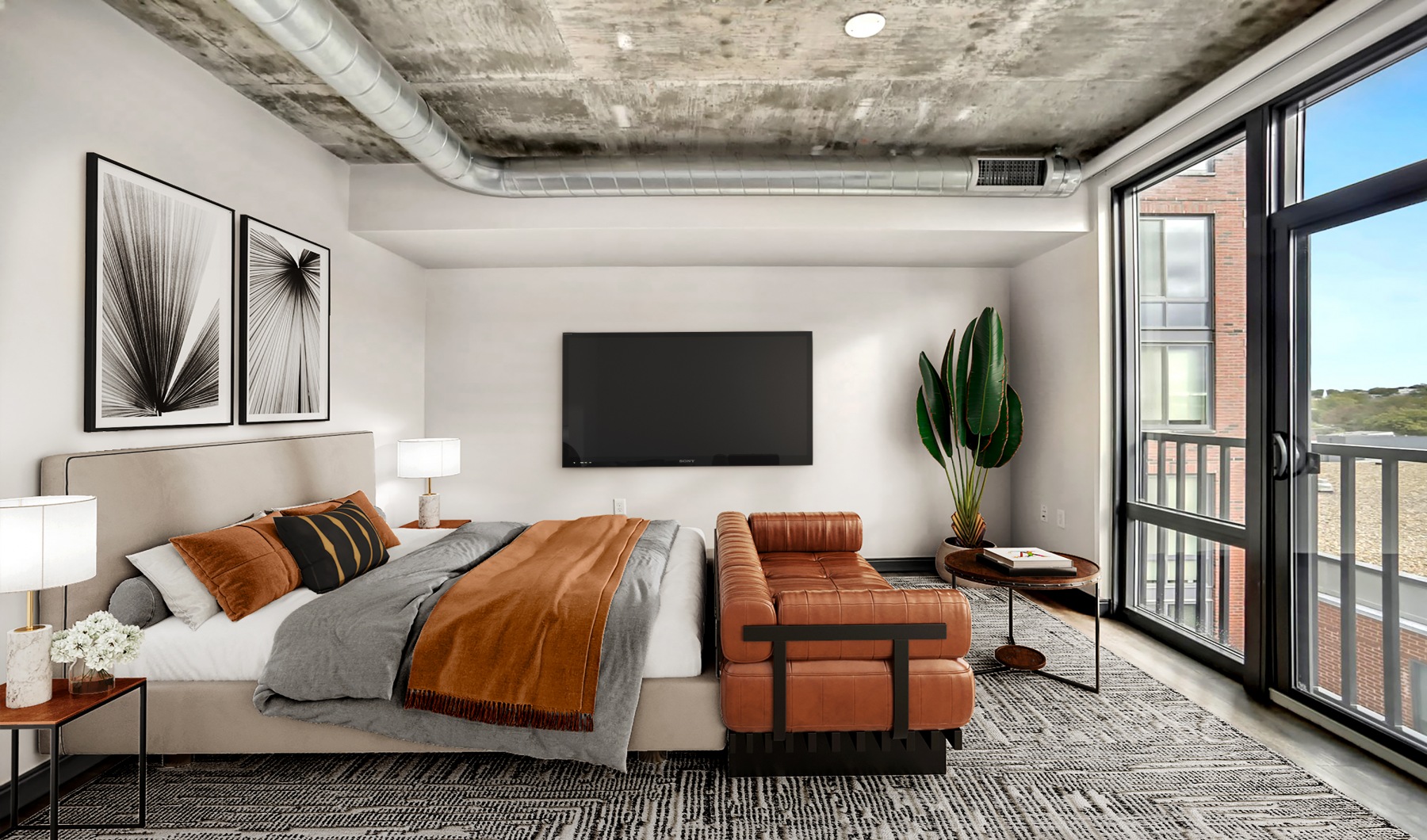 studio bedroom and living room with concrete ceilings and wood floor